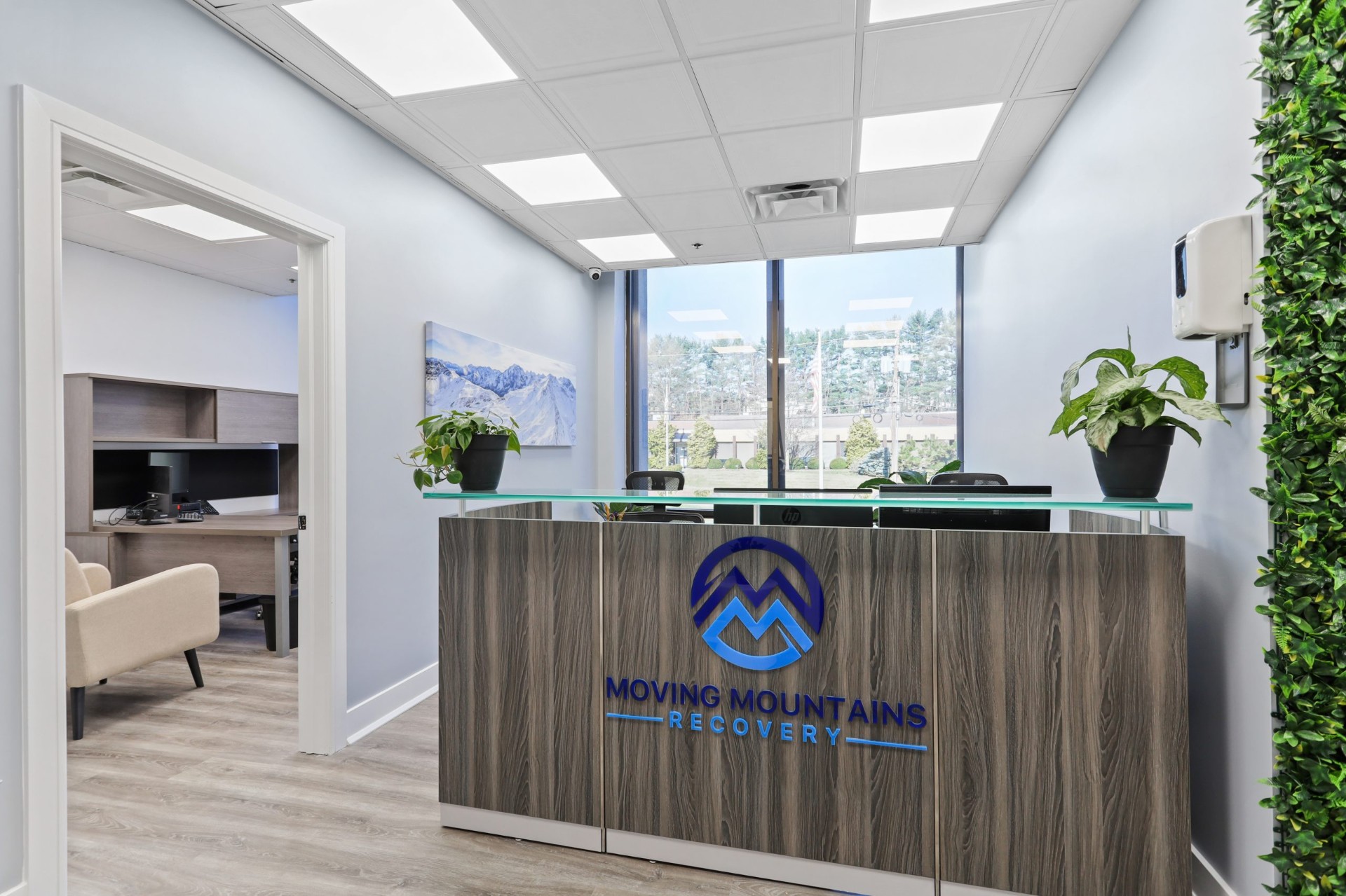 Moving Mountains Recovery lobby with illuminated mountain logo