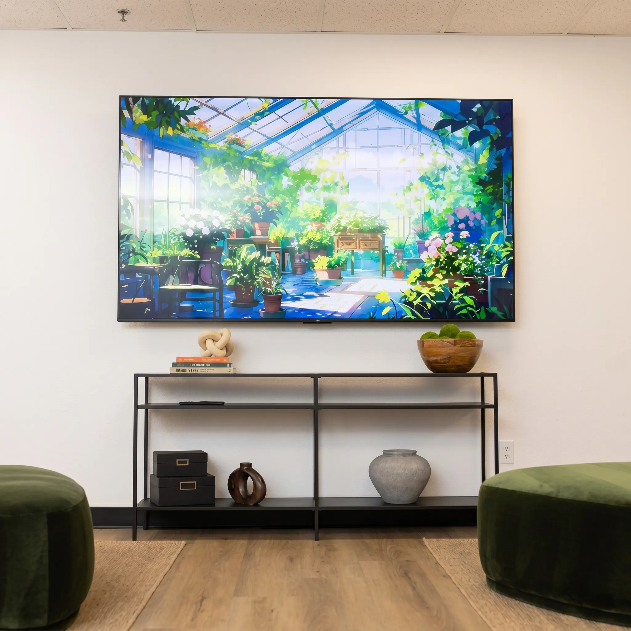 Reception lounge with greenhouse mural and green ottomans